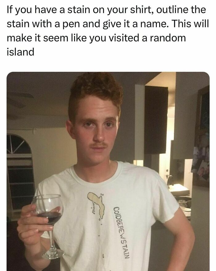 Young adult with a stain on shirt outlined and named, holding a glass, showing relatable student life humor.