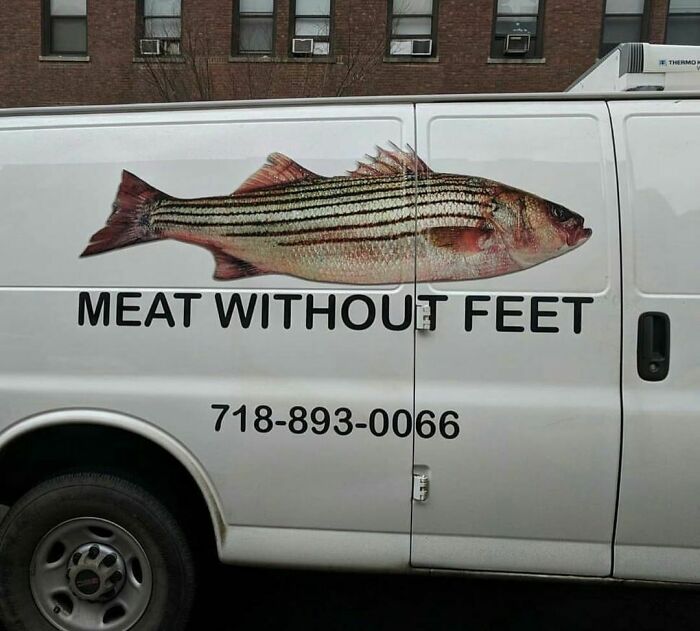 White delivery van with a large fish graphic and the phrase meat without feet, showcasing random and cringe humor.