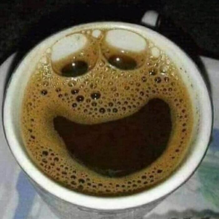 Coffee cup with a bubbly, smiling face illusion on the surface, highlighting the weirdest Instagram content.