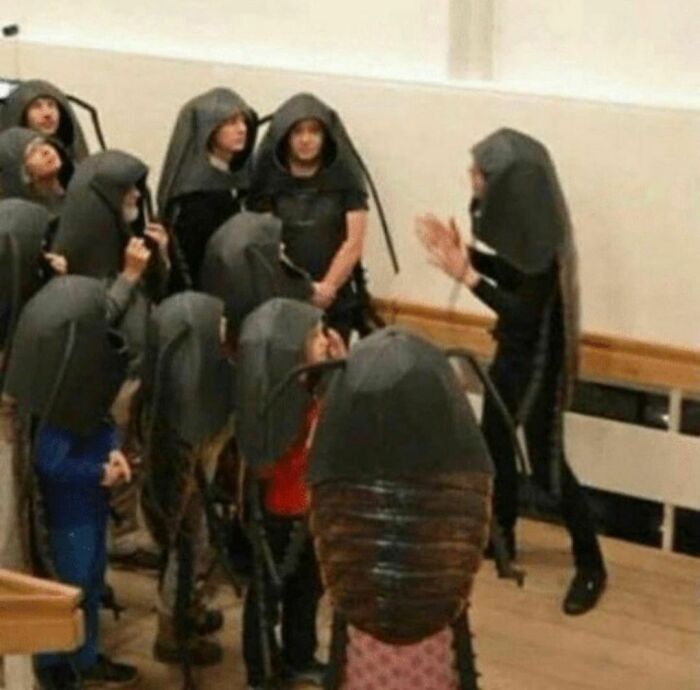 People wearing cockroach costumes in a room, creating a bizarre scene, from the weirdest Instagram account.
