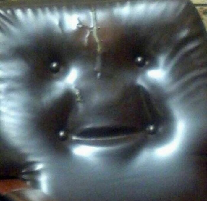 A chair cushion oddly resembles a face with a slightly distressed expression for the weirdest Instagram account.