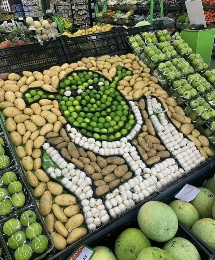 Shrek face made from fruits and vegetables in a grocery store, showcasing the weirdest Instagram content.