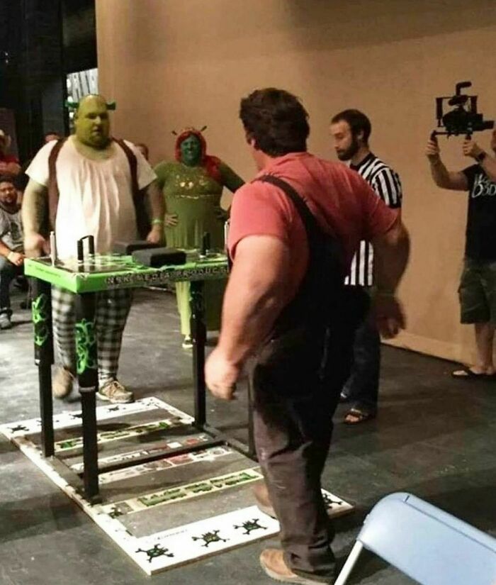 People in Shrek costumes playing a tabletop game, reflecting the quirky content of a weird Instagram account.