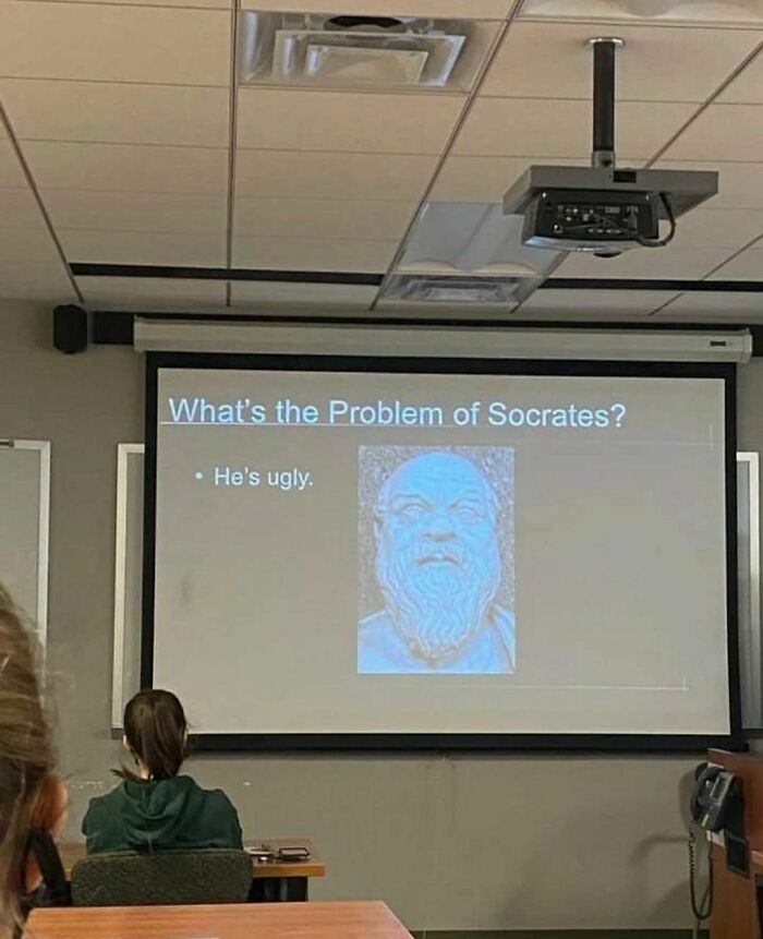 Classroom slide with text "What's the Problem of Socrates? He's ugly," featured on a quirky Instagram account.