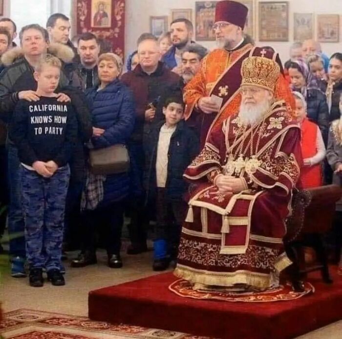 Weird Instagram account image of a boy wearing "California Knows How to Party" shirt in a formal church setting.