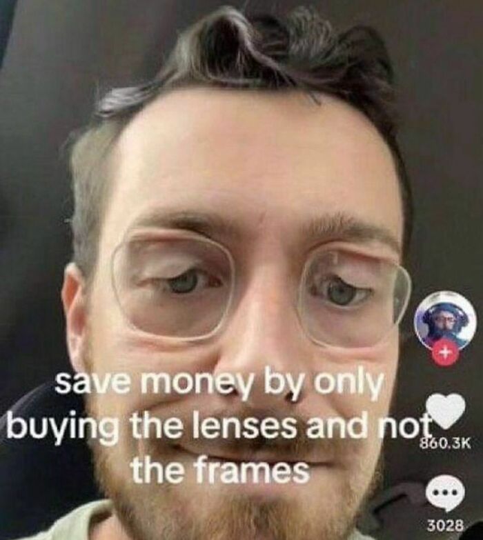 Man wearing eyeglass lenses without frames causing an awkward distorted face in an awkward photo moment.