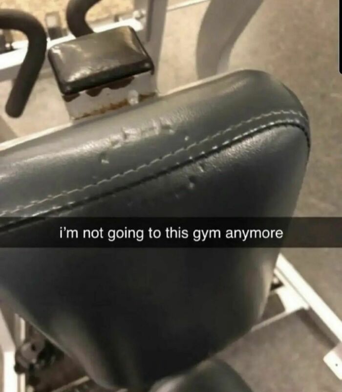 Worn-out gym seat with damaged padding, capturing an awkward moment many find almost painful to look at.