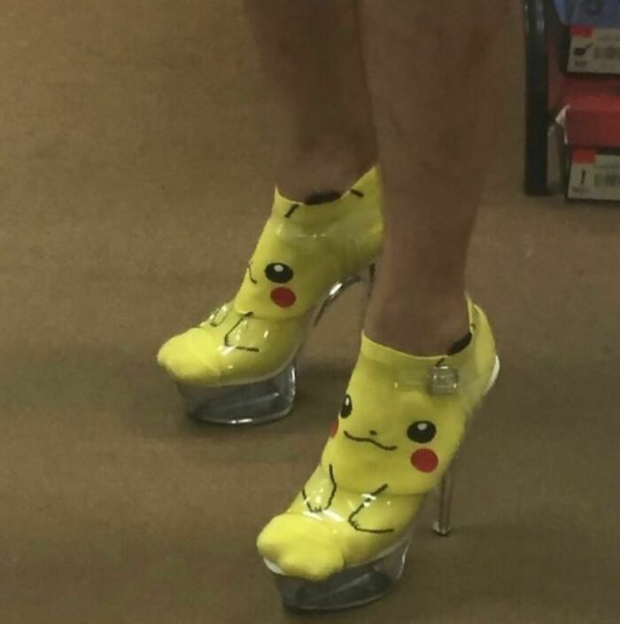 Yellow Pikachu-themed high heels worn by a person, showcasing awkward photos of unusual footwear choices.