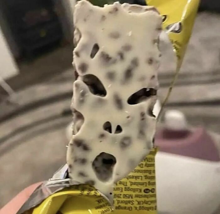 Close-up of a snack bar with an awkward pattern resembling a face, fitting the theme of awkward photos.