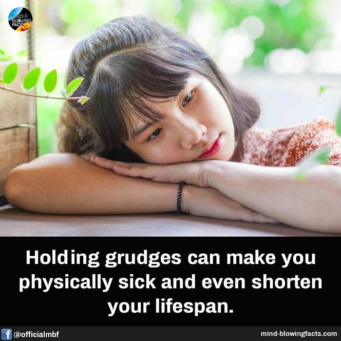 A contemplative person rests on a table next to text about how grudges impact health.