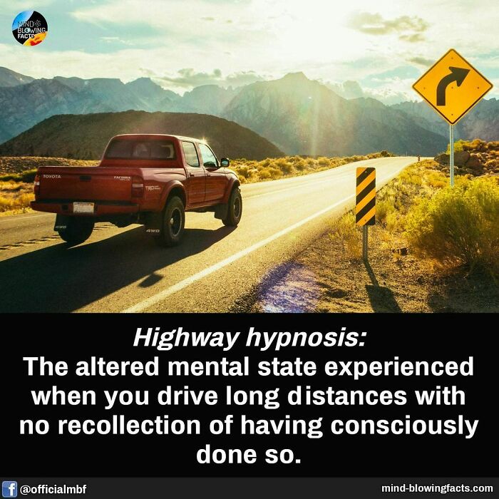 Red truck on sunny highway with a mountain view, depicting highway hypnosis.