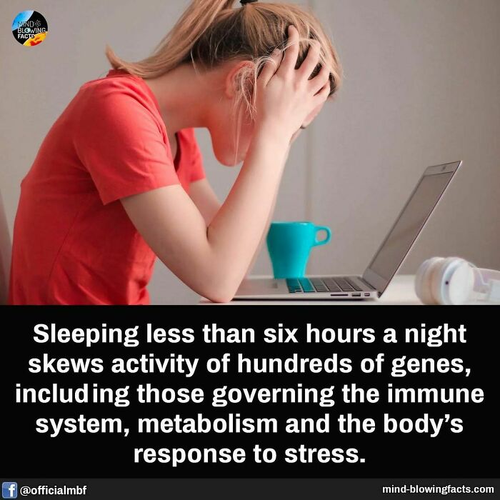Woman in red shirt stressed at laptop, illustrating an amazing fact about sleep’s impact on genes and metabolism.