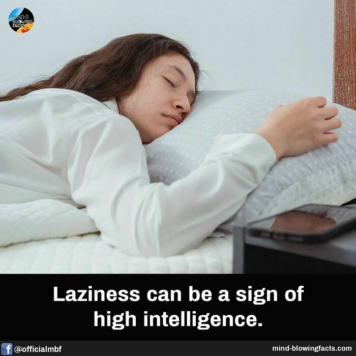 Woman lying on bed with eyes closed, illustrating an amazing fact about laziness and high intelligence from Instagram facts page.