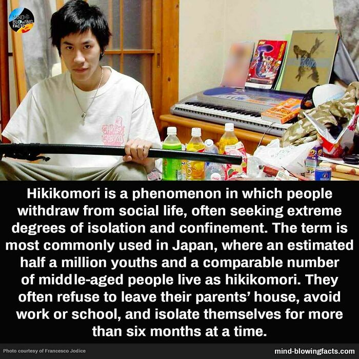 Young man sitting in a room with drinks and snacks, illustrating mind-blowing facts about social isolation known as hikikomori.