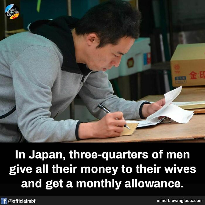 Man in Japan writing at a desk, illustrating mind-blowing facts about money management and cultural practices.