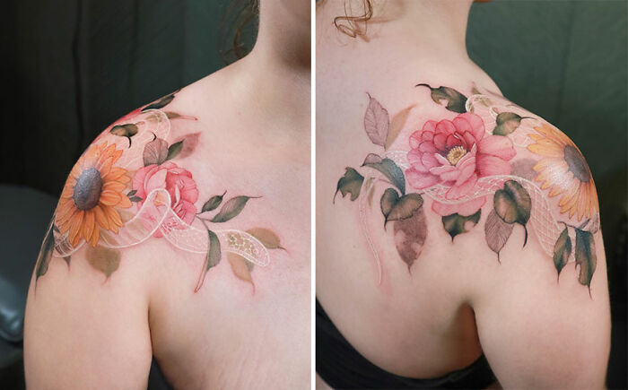 Watercolor tattoo design of flowers on a person's shoulder, showcasing intricate and colorful artistic details.