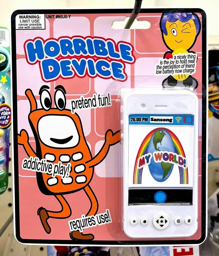 Fake product by Obvious Plant in store, labeled "Horrible Device," parodying a smartphone with humorous packaging.