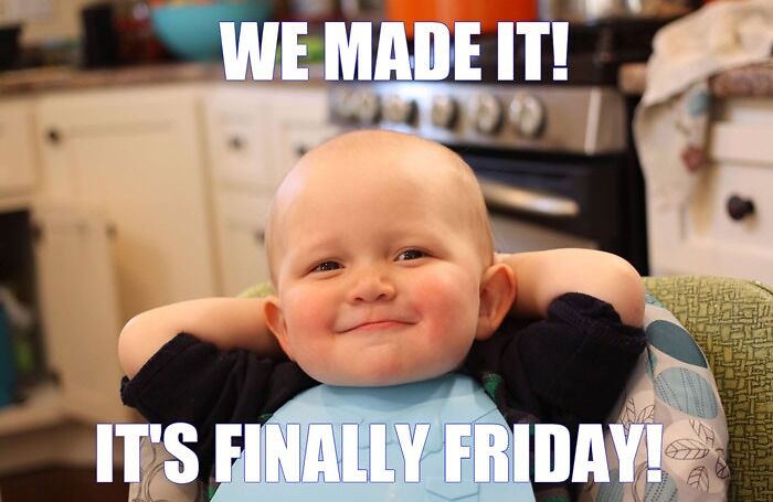 Baby smiling with hands behind head, text reads "We made it! It's finally Friday!" Perfect happy Friday meme.