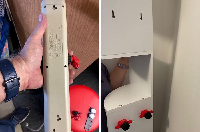 Hand holding a power strip being mounted on a wall organizer showing clever home hacks for an organized life.