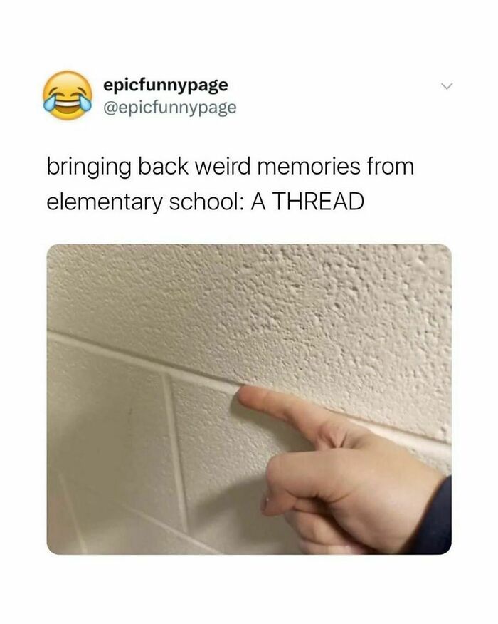 Finger pointing at a school wall, evoking random meme nostalgia and childhood memories.