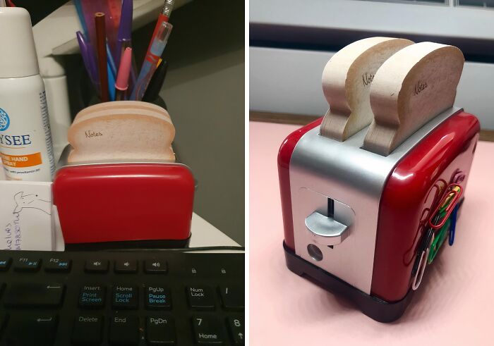 Red toaster-shaped note holder with bread-shaped sticky notes and paperclips, a unique work supply on a desk.