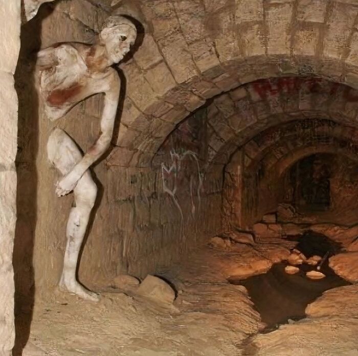 The Le Passe-Muraille (Passer-Through-Walls ) Sculpture In The Paris Catacombs