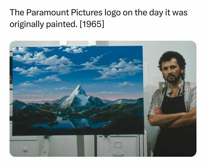 Painter standing next to the original 1965 Paramount Pictures logo mountain painting, a notable history fact.