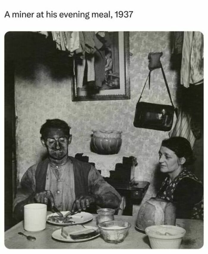 A miner and woman at their evening meal in 1937, a historical moment shared by history facts followers.