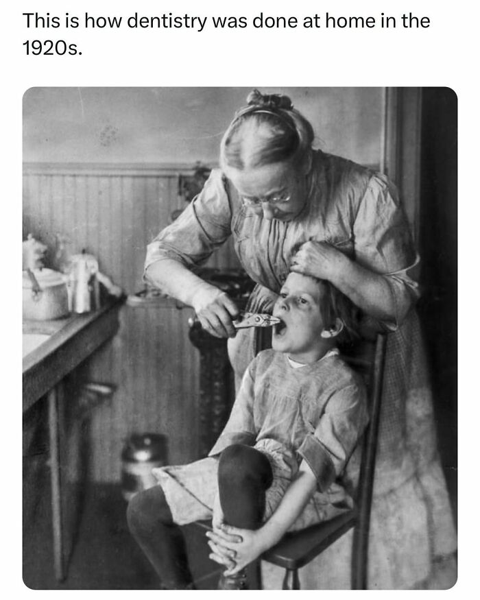 Woman performing home dentistry on a child in the 1920s, a vintage history fact shared by over 1M history facts followers.