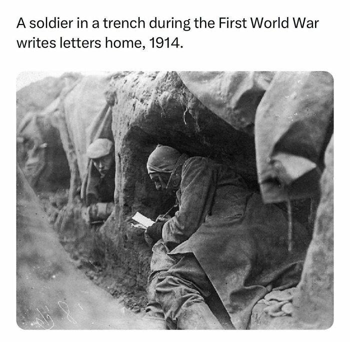 World War I soldier writing letters in a trench, an iconic history fact from the daily dose of history facts page.