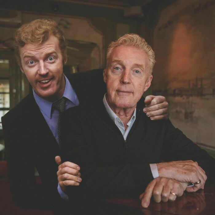 Celebrity photoshopped with younger self, highlighting change over time in a casual indoor setting.