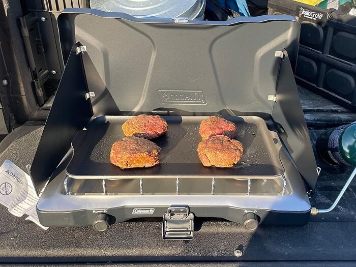 Your Camping Crew Will Think You're A Culinary Wizard With This Coleman Triton Stove By Your Side