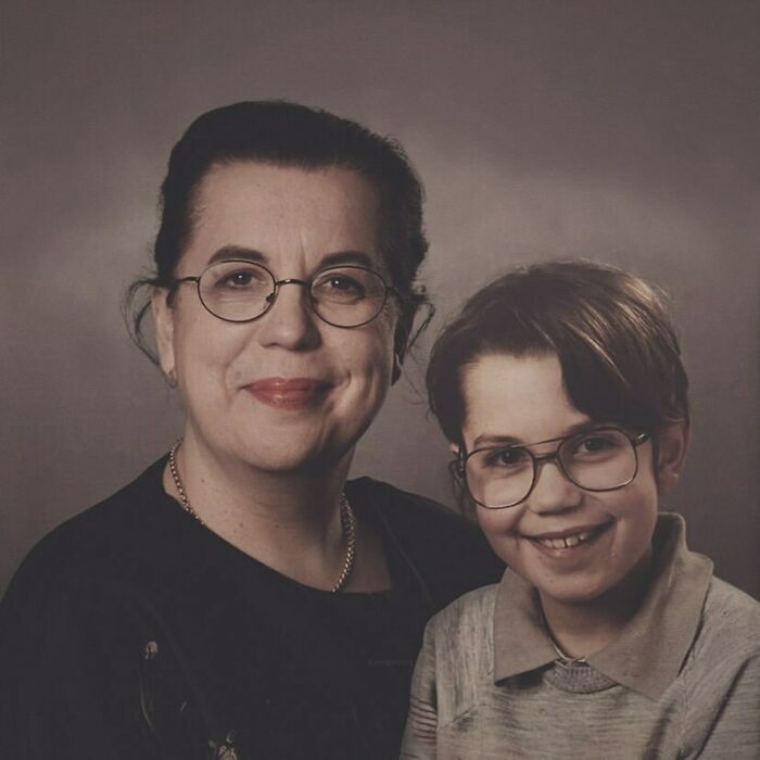Woman posing with a younger version of herself, both wearing glasses, showcasing the passage of time.