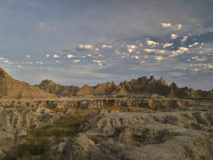 Breathtaking landscape of rugged rock formations under a partly cloudy sky, highlighting natural beauty from ReFocus Awards.