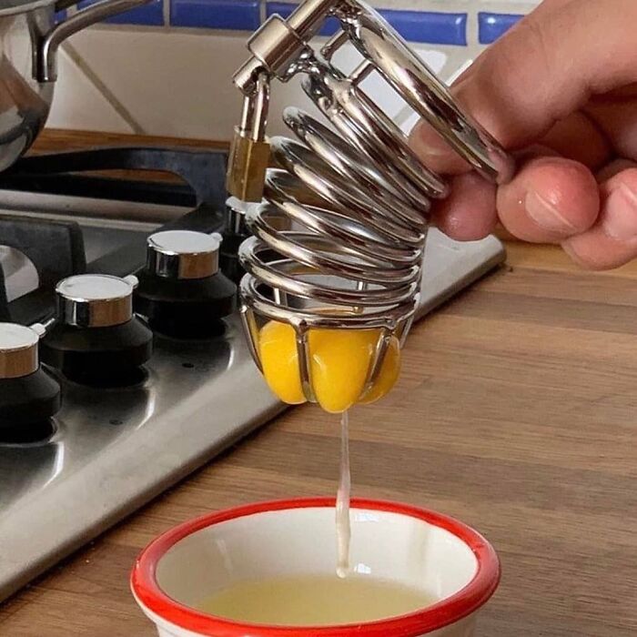 Hand squeezing egg yolks with a metal tool over a bowl, featured on a page sharing cursed pics and memes.