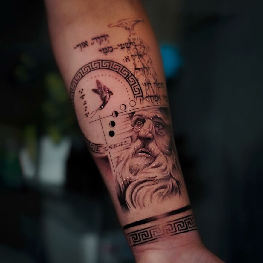 Single needle tattoo of a bearded face and bird, with geometric patterns and text, on a forearm.