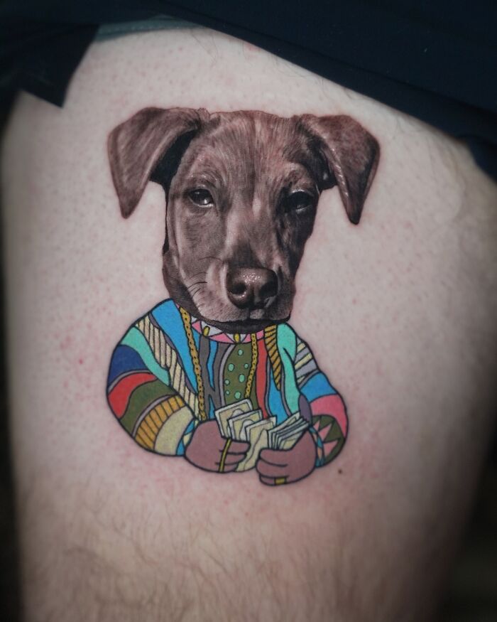 Tattoo of a dog in colorful sweater, blending two artistic styles seamlessly.