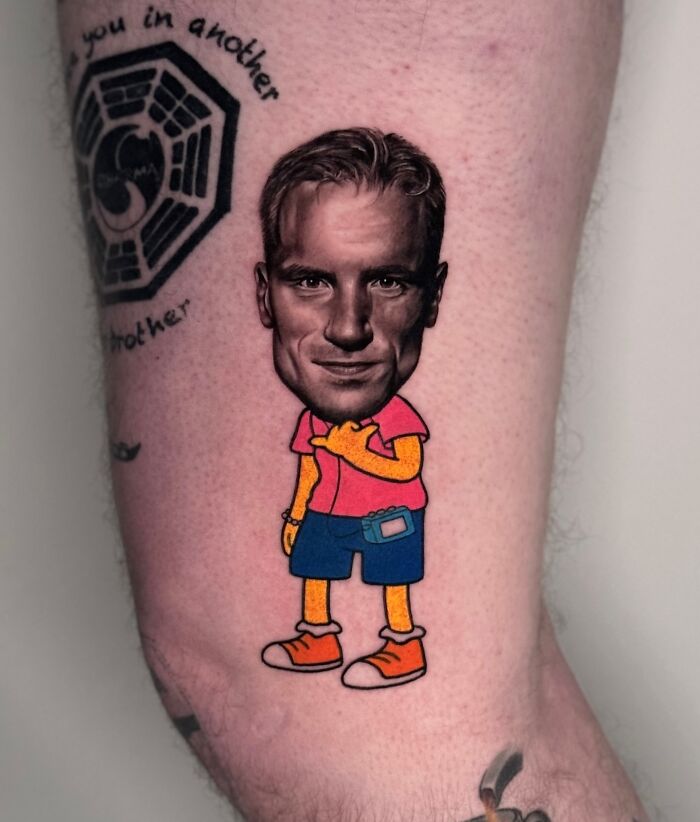 Tattoo combining cartoon body with a realistic face, demonstrating a seamless merge of two artistic styles.