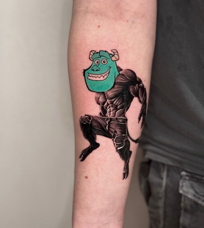 Tattoo blending two artistic styles: a colorful cartoon face on a detailed black and white body on an arm.