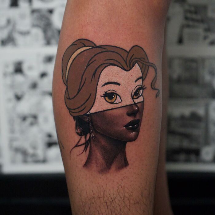 Tattoo seamlessly merging two artistic styles on leg, featuring a dual-faced design.