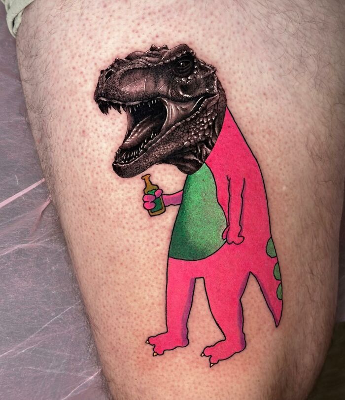 Tattoo merging dinosaur head with cartoon-style body, blending two artistic styles seamlessly.