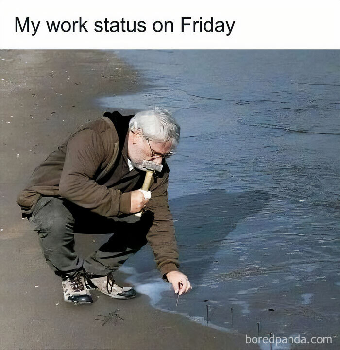 Man humorously hammering nails into sand, capturing a Happy Friday meme vibe.