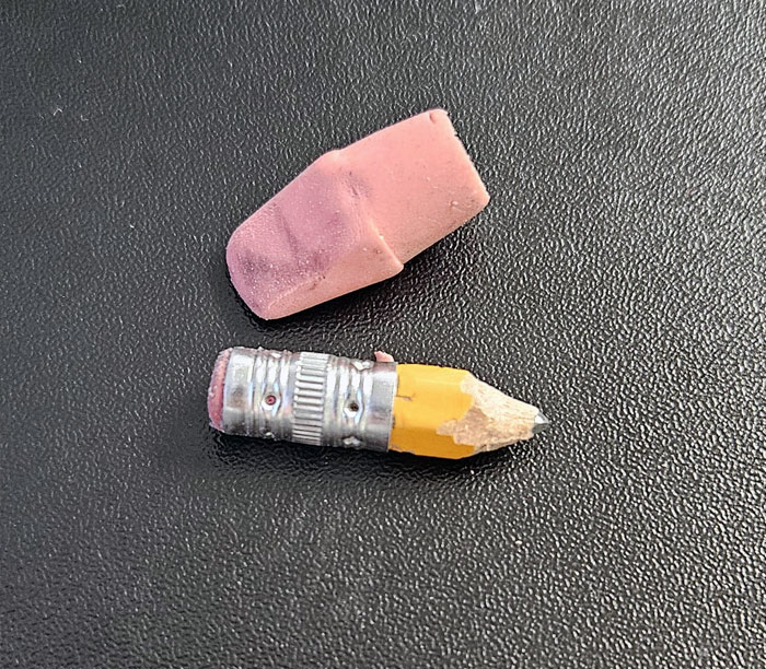 My Coworkers Make Fun Of My Pencil. Why Get A New One When I Can Use This Entire One First? It's Too Small To Sharpen, So I Have To Use A Razor Blade