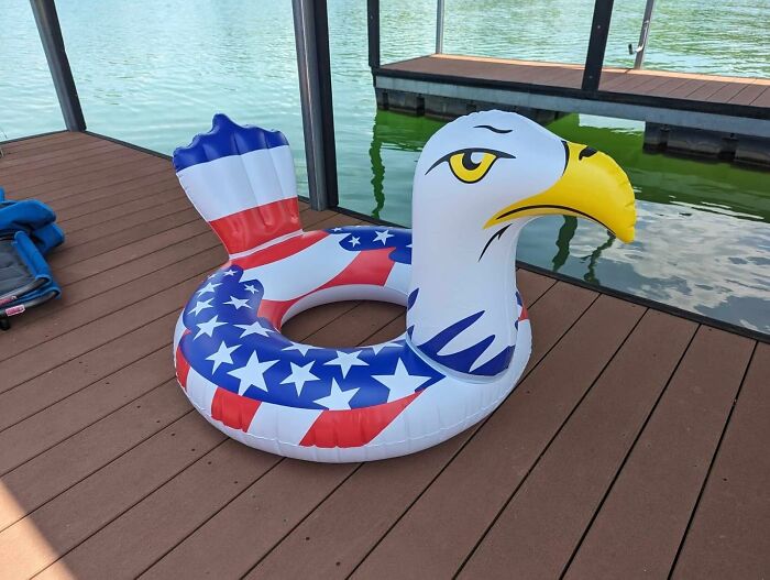 Inflatable pool float with patriotic American flag design shaped like an eagle, perfect for backyard July 4th parties.