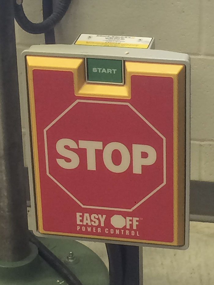 In My Design Tech Class, The Stop Buttons For The Machines Are Far Larger Than The Start Button For Safety, Allowing You To Hit The Stop Button With Your Leg In Case Of Emergency