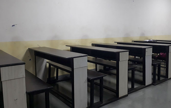 Students Lean On The Wall During Lectures (The Ghost Classroom)