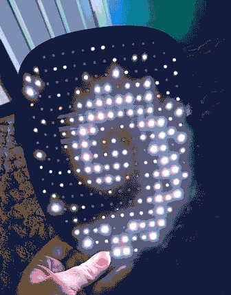 LED dots arranged in a swirling pattern on a dark surface, creating an eye-catching visual effect.