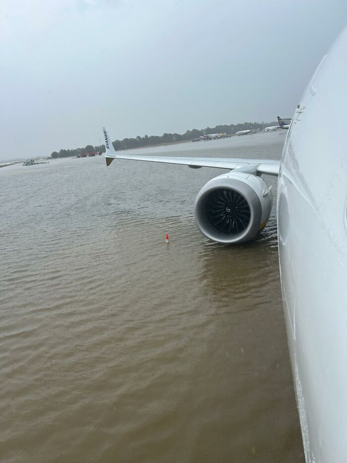 After Airport Floods, Hilarity Ensues As Workers Clean Up Water With Brooms, Swim On The Tarmac After Airport Floods, Hilarity Ensues As Workers Clean Up Water With Brooms, Swim On The Tarmac