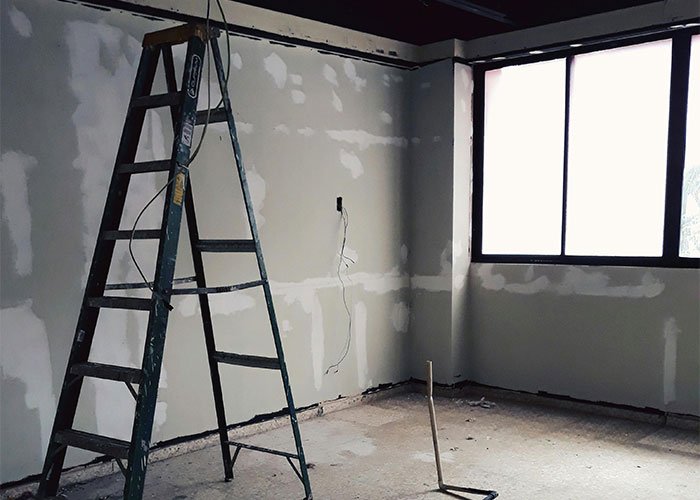 Ladder in unfinished room under construction, highlighting everyday things most people don’t realize are deadly risk.