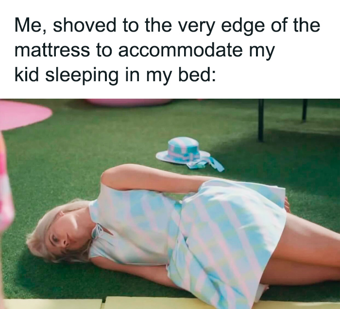 Woman humorously lying on the grass, captioned about sharing a bed with a toddler.